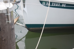 Before the food is aboard. Note green and black stripes, and the distance between the water and the metal fitting